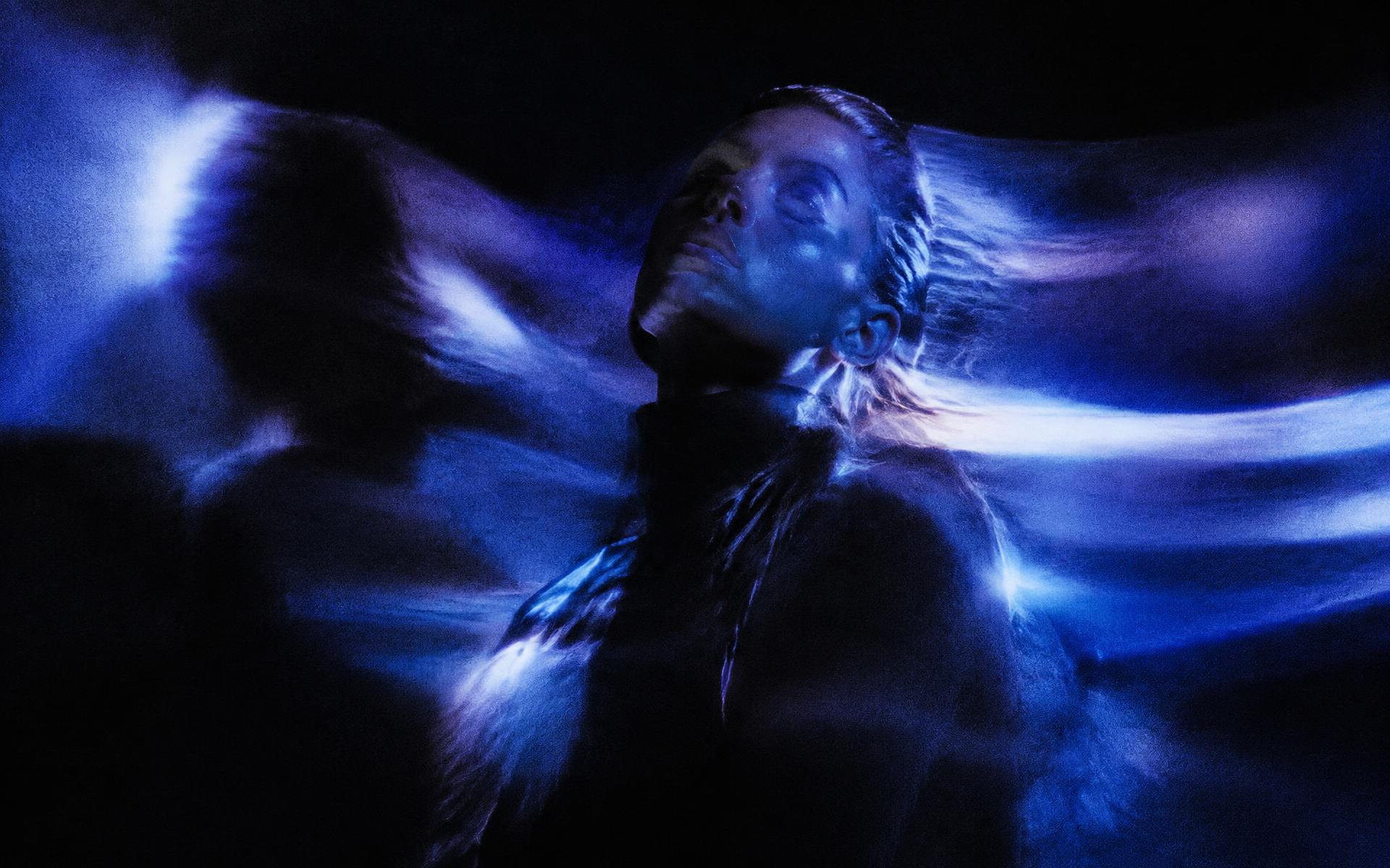 Cinematic portrait in electric blue light